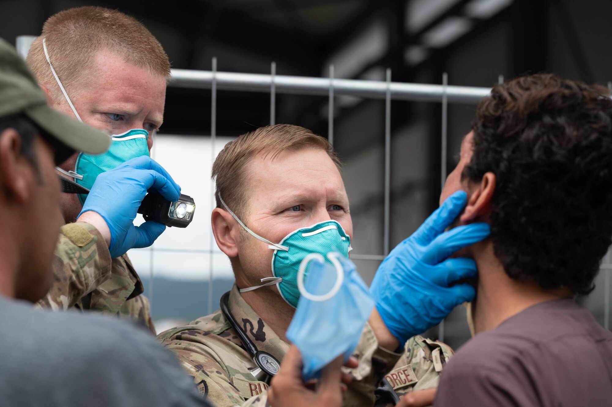 Medical staff work with evacuees.