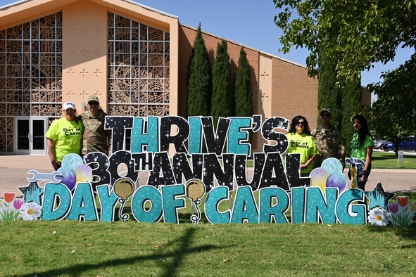 49th Wing leadership and Thrive’s leading members pose for a picture in front of Thrive’s 30th Annual Day of Caring sign, Sept. 10, 2021, at Alamogordo, New Mexico. Thrive in Southern New Mexico is a non-profit organization in charge of Day of Caring. (U.S. Air Force photo by Airman 1st Class Jessica Sanchez-Chen)