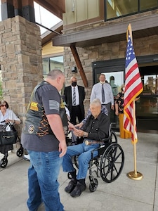 Warren Olsen being honored on 2 August 2021 (100th birthday) by Dave Jorgensen, Commander CVMA 49-3 and other Vets.