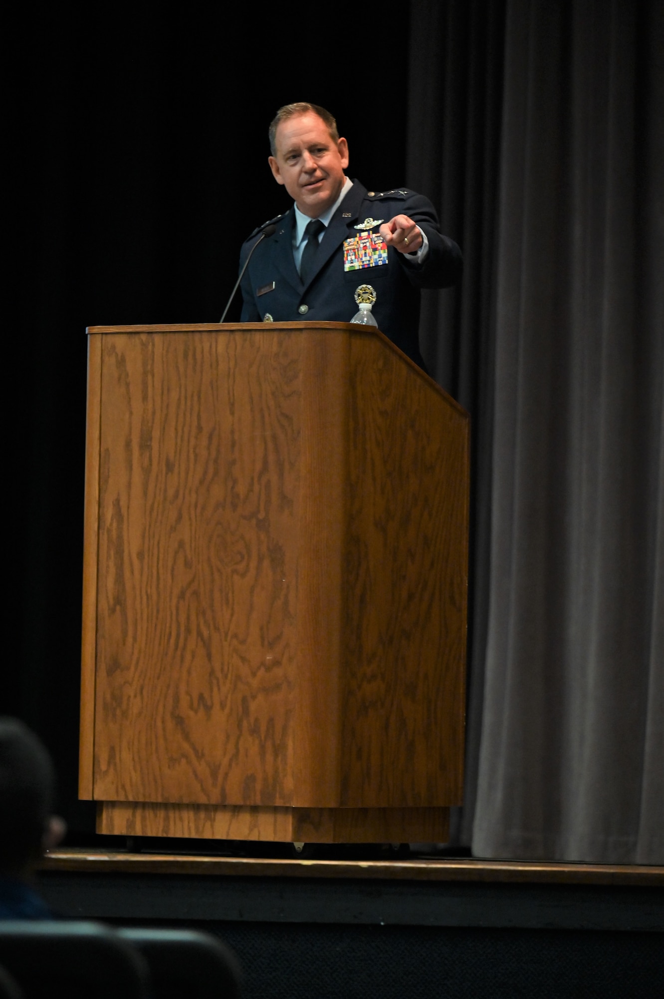 U.S. Air Force Lt. Gen. James Hecker, Air University Commander and President, giving his speech during the graduation ceremony of Specialized Undergraduate Pilot Training Class 21-15, Sept. 10, 2021, on Columbus Air Force Base, Miss. Graduates of SUPT have to complete a demanding 52-week course, comprised of academics, physiological training, and flight training in the T-6A Texan II, T-1A Jayhawk, and T-38C Talon. (U.S. Air Force photo by Senior Airman Jake Jacobsen)