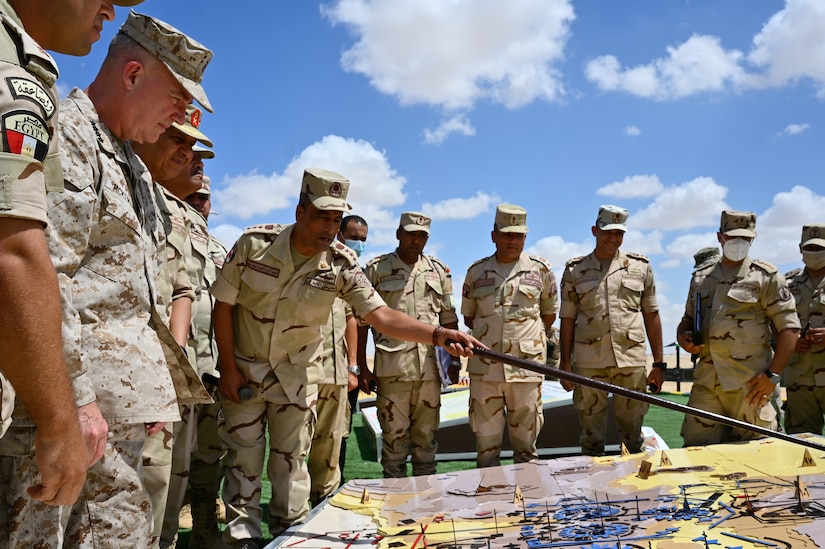 General Kenneth F. McKenzie, Jr., Commander, United States Central Command (USCENTCOM), receives a brief given by U.S., and Coalition forces participating in the Field Training exercise (FTX) during Bright Star 21 (BS21) at Mohamed Naguib Military Base (MNMB), Egypt, Sept. 11, 2021. BS21 is a multilateral exercise hosted by the Arab Republic of Egypt with support from USCENTCOM. The exercise contains three key events: a Command-Post Exercise (CPX), FTX, and a Senior Leader Seminar. The purpose of BS21 is to promote and enhance regional security and cooperation, promote interoperability in irregular warfare against 21st Century hybrid threat scenarios, and to enhance interoperability throughout the full range of military operations. (U.S. Army photo by Spc. Amber Cobena)