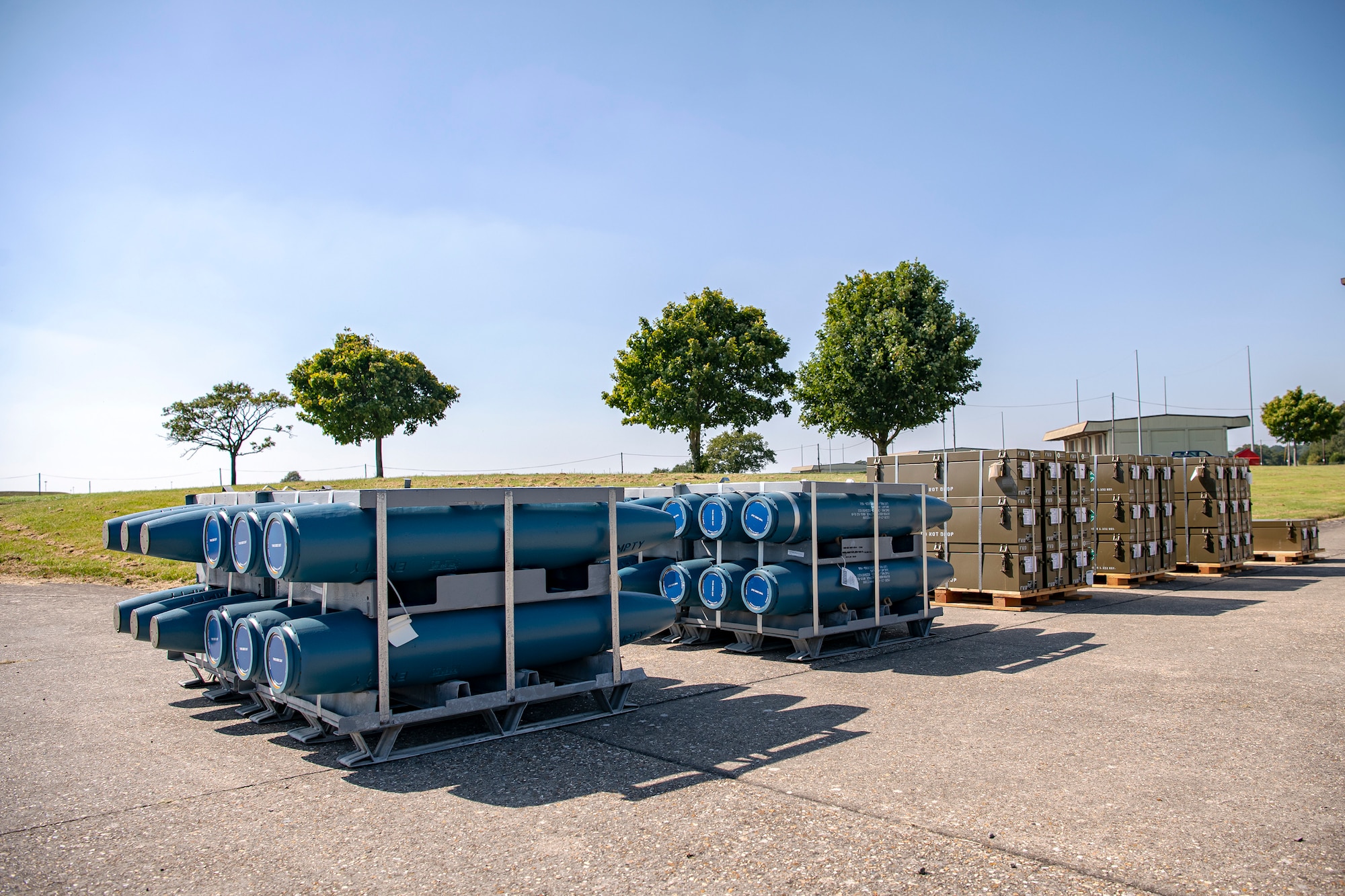 Inert assets rest on a loading dock prior to an asset transport at RAF Welford, England, Sept. 7, 2021. Airmen from the 420th MUNS constructed multiple wooden structures and supports to help stabilize inert assets to be transported to RAF Lakenheath for an upcoming Agile Combat Employment exercise. (U.S. Air Force photo by Senior Airman Eugene Oliver)