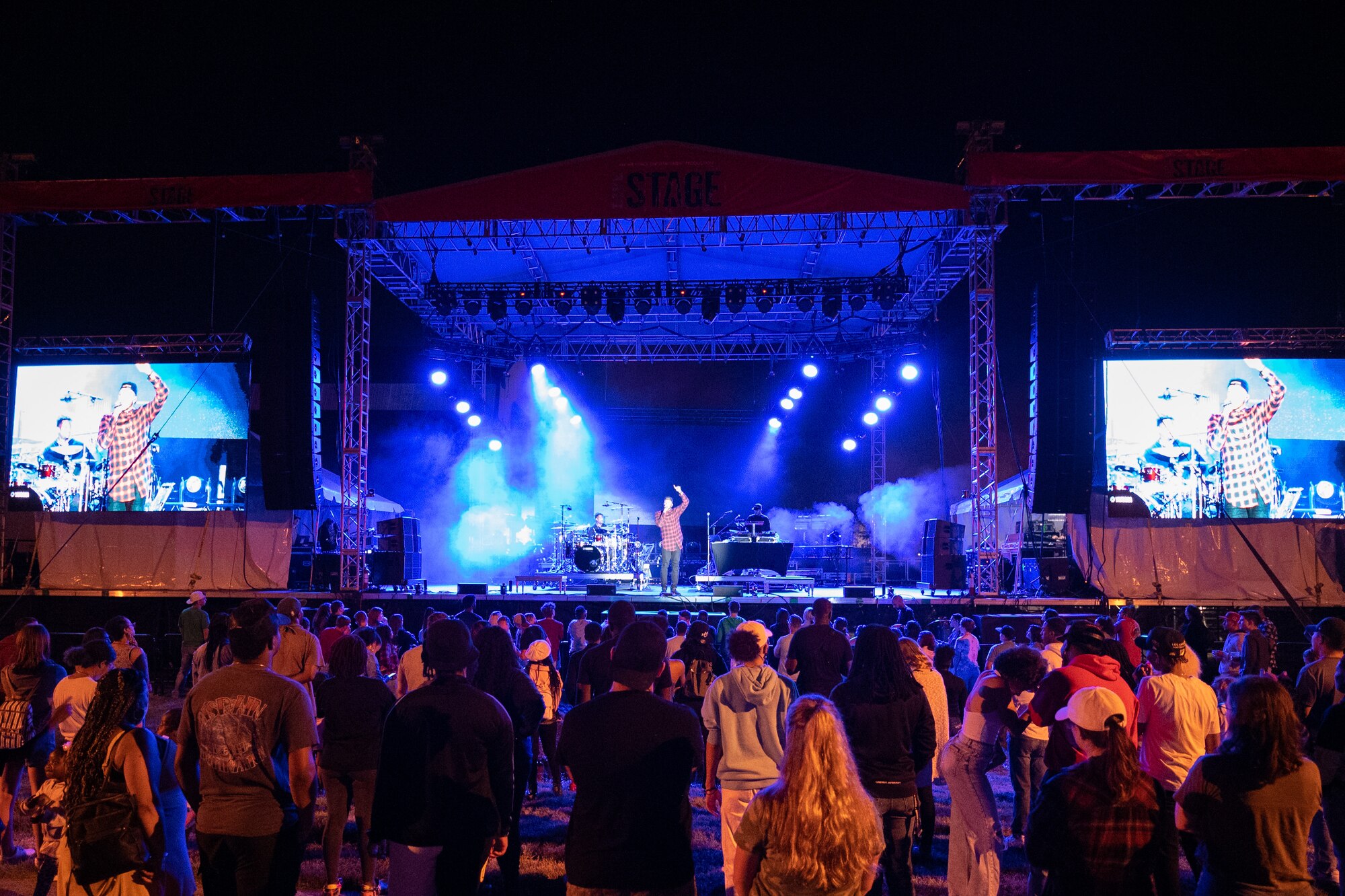 Hip-hop artist Lecrae performs before a
crowd of spectators at the End of
Summer Concert on Dover Air Force
Base, Delaware, Sept. 10, 2021. The free
concert was open to all Team Dover
Airmen and their families. (U.S. Air Force
photo by Mauricio Campino)