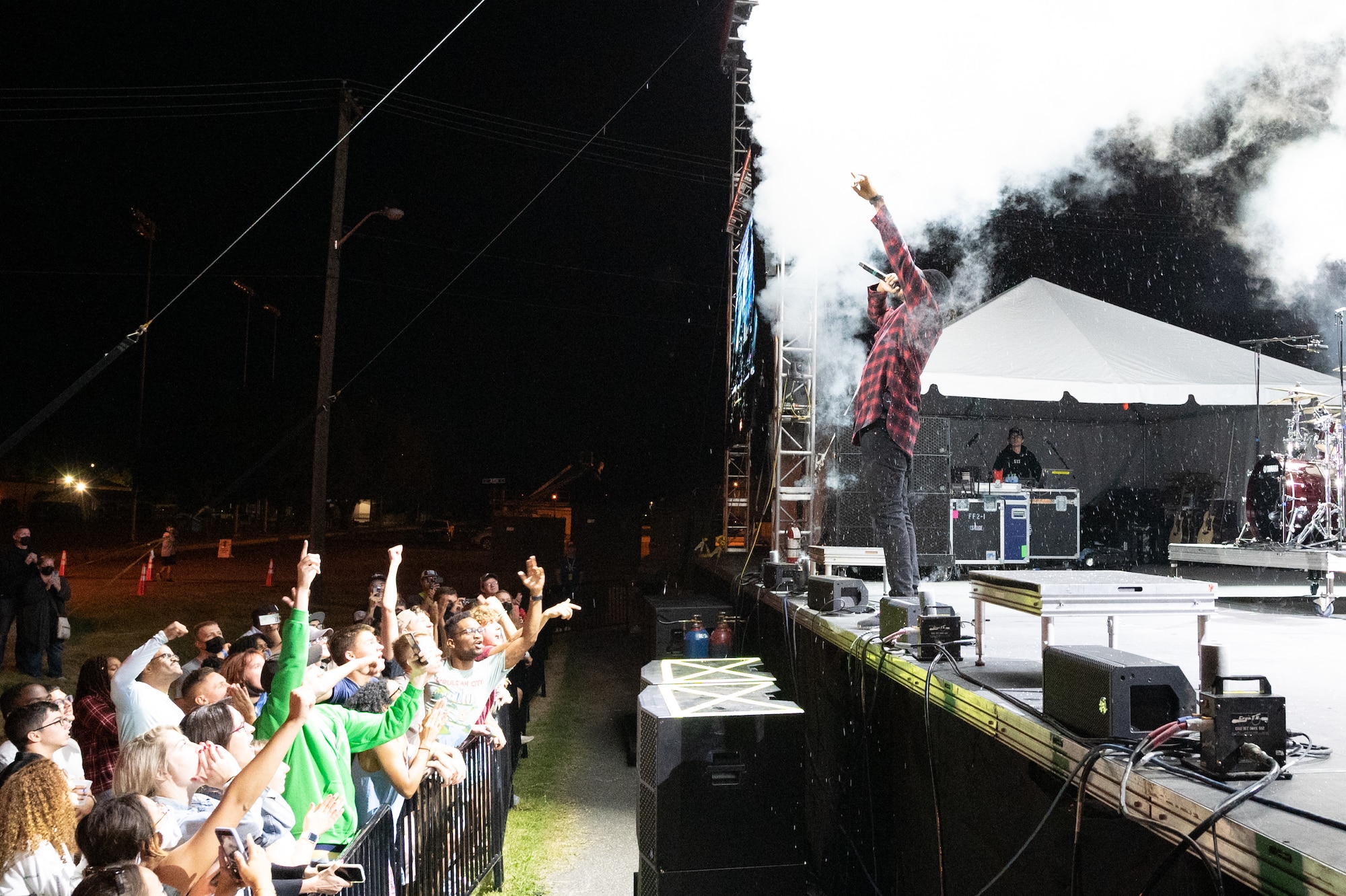 Hip-hop artist Lecrae performs before a
crowd of spectators at the End of
Summer Concert on Dover Air Force
Base, Delaware, Sept. 10, 2021. The free
concert was open to all Team Dover
Airmen and their families. (U.S. Air Force
photo by Mauricio Campino)