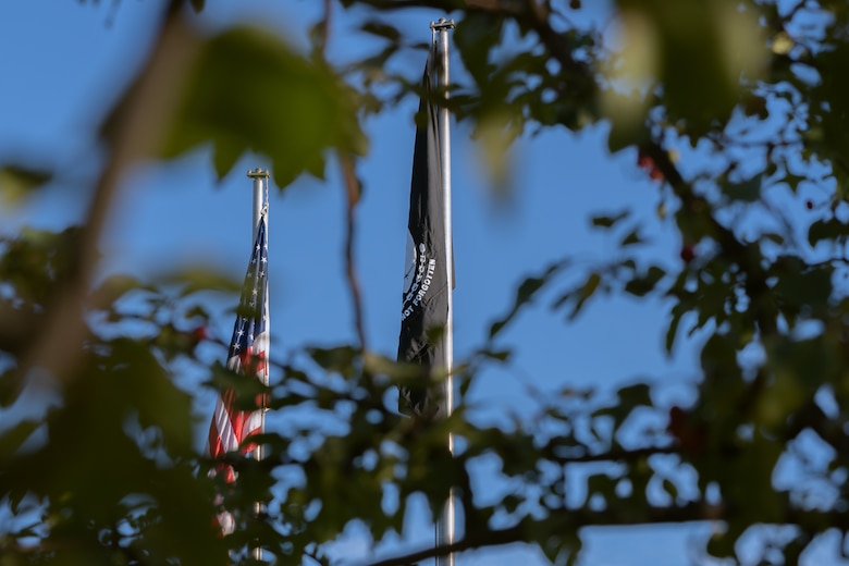 The U.S. and the Prisoner of War/Missing in Action flags fly above the Vosler Noncommissioned Officer Academy.