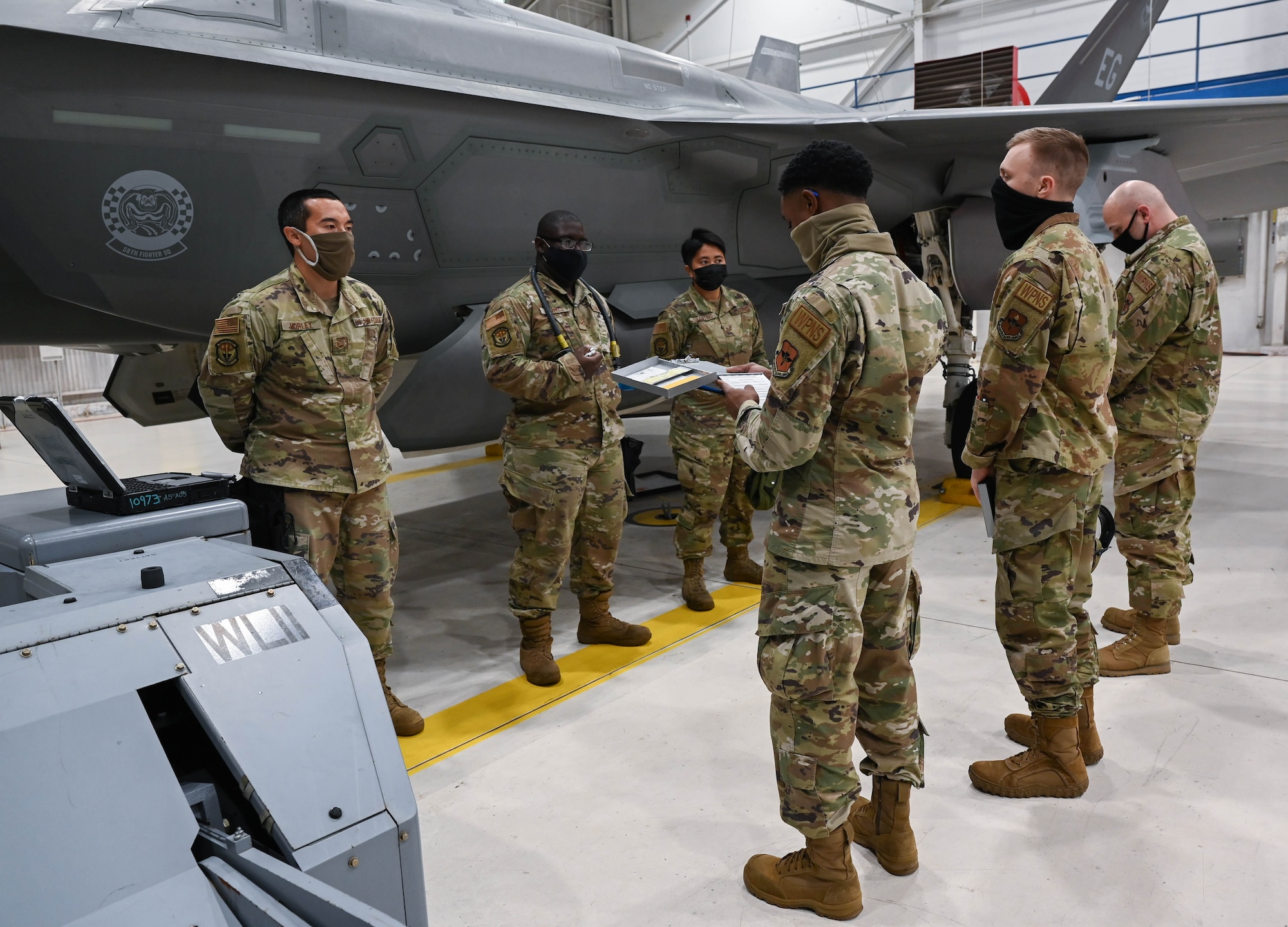 Weapons Standardization crew members evaluating  a load crew