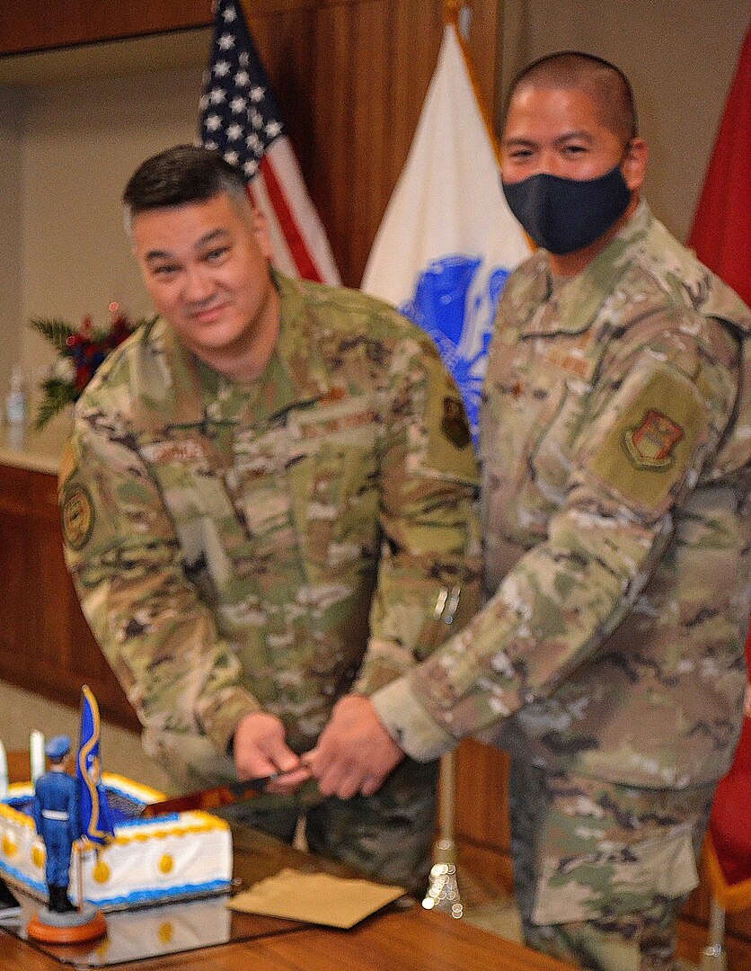 Air Force Col. Adrian Crowley, left, and Maj. Francisco Boral cut a cake in recognition of the Air Force’s 74th birthday September 14, 2021 in Philadelphia.