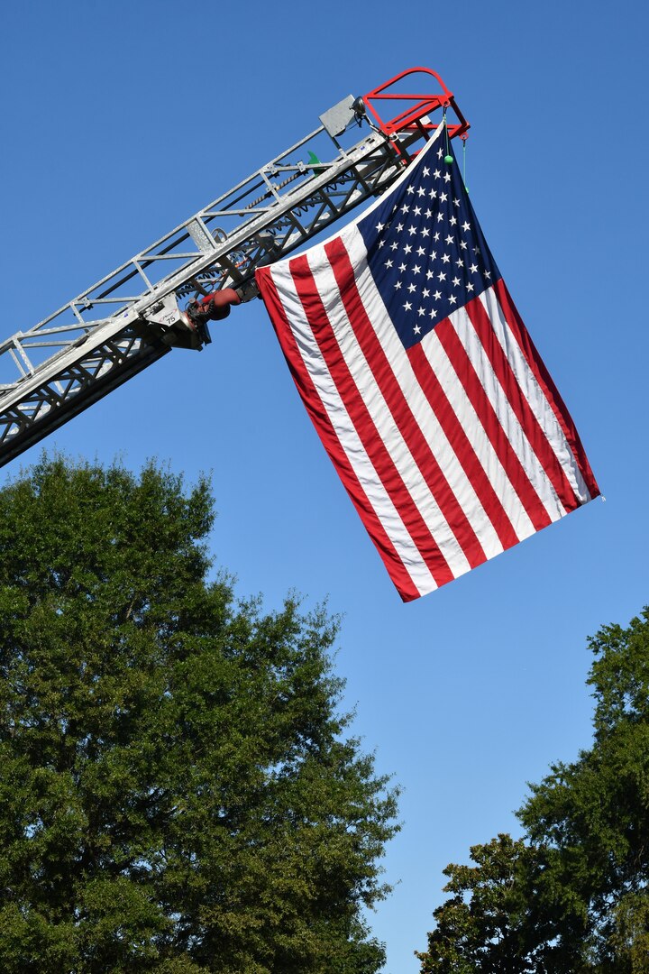 IMAGE: The U.S. Flag flies in the breeze during the 9/11 Remembrance held ahead of the 20th anniversary.