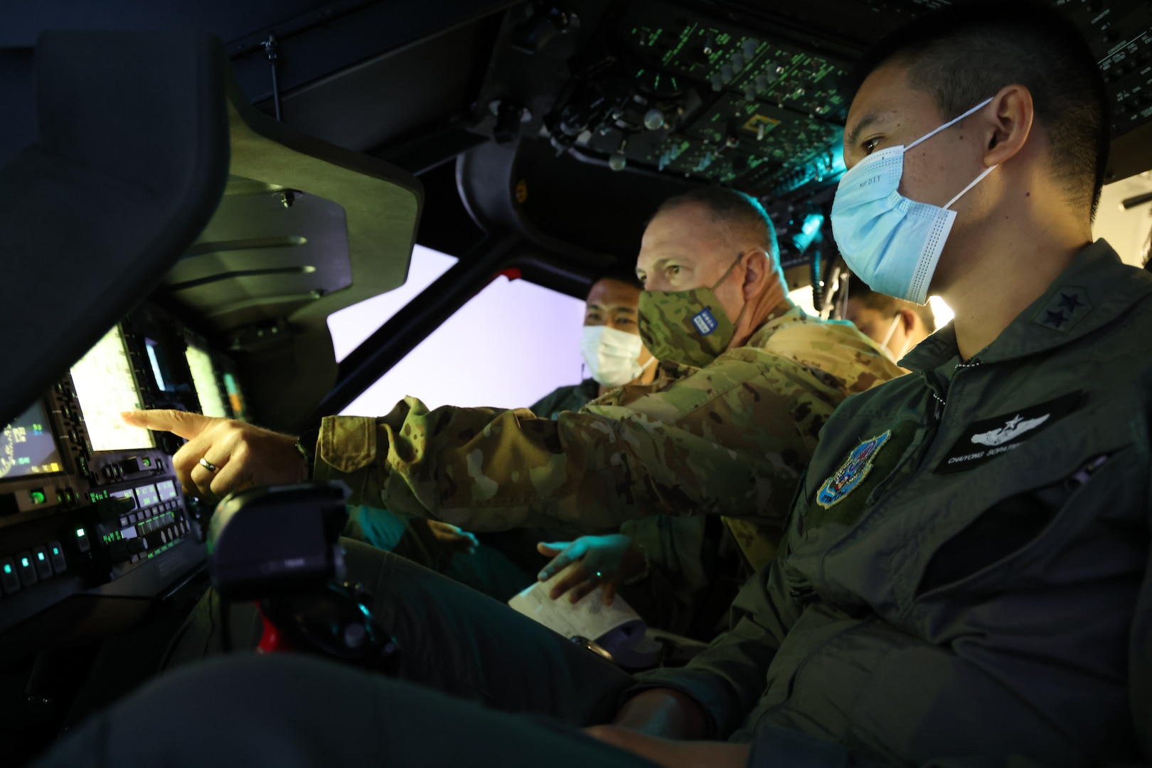 Chief Warrant Officer 4 Ryan Kennedy, a UH-60 Black Hawk helicopter pilot with the 96th Aviation Troop Command, Washington Army National Guard, trains with his Royal Thai Army counterparts in a Black Hawk simulator, Aug. 31, 2021, at Joint Base Lewis-McChord. The exchange was part of the State Partnership Program, which pairs a state or territory's National Guard with a partner nation to enhance security cooperation around the globe.