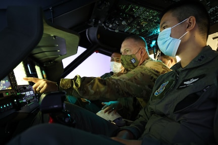 Chief Warrant Officer 4 Ryan Kennedy, a UH-60 Black Hawk helicopter pilot with the 96th Aviation Troop Command, Washington Army National Guard, trains with his Royal Thai Army counterparts in a Black Hawk simulator, Aug. 31, 2021, at Joint Base Lewis-McChord. The exchange was part of the State Partnership Program, which pairs a state or territory's National Guard with a partner nation to enhance security cooperation around the globe.