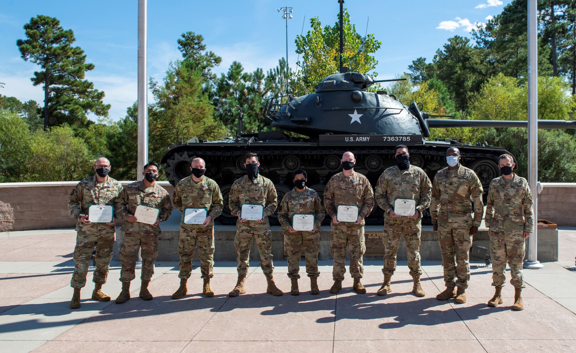 Airmen and Soldier stand for a photo.