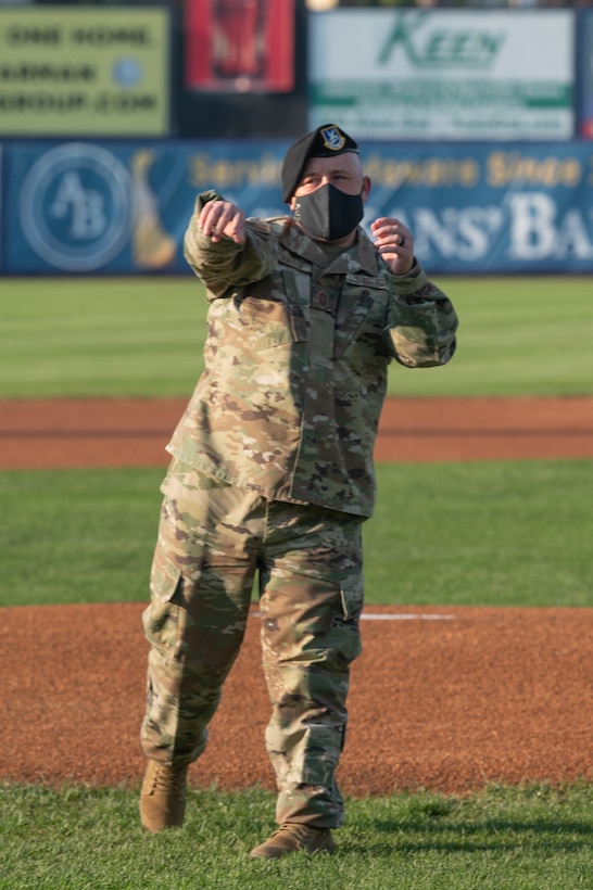 Chief Master Sgt. Eddie Ray, 436th Mission Support Group superintendent, throws the first pitch before a baseball game at Daniel S. Frawley Stadium in Wilmington, Delaware, Sept. 11, 2021. The pre-game ceremony featured a moment of silence remembering those who perished during the 9/11 terrorist attacks. (U.S. Air Force photo by Mauricio Campino)