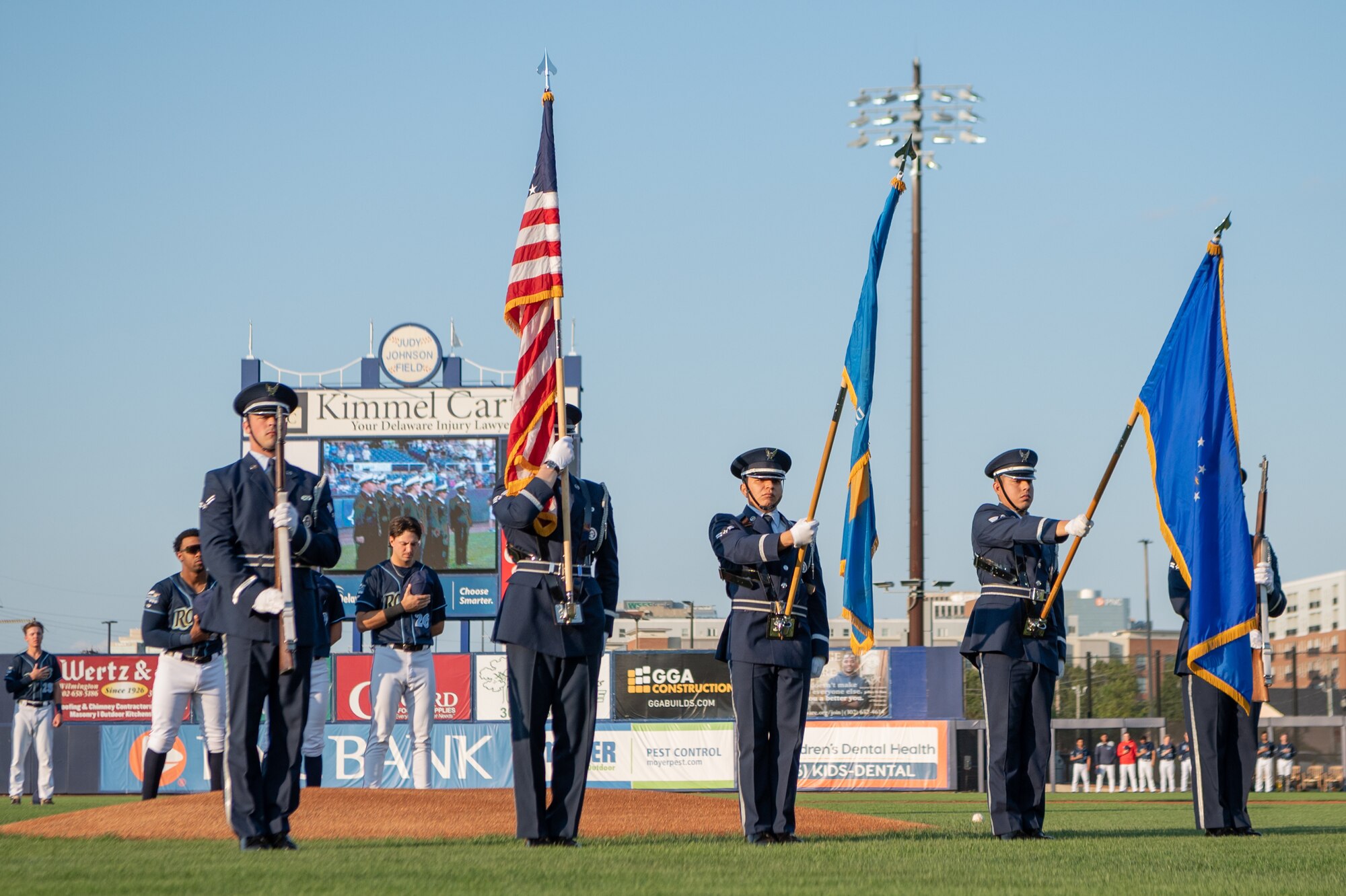 The Dover Air Force Base Honor Guard presents the colors during the national anthem at Daniel S. Frawley Stadium in Wilmington, Delaware, Sept. 11, 2021. The pre-game ceremony featured a moment of silence remembering those who perished during the 9/11 terrorist attacks. (U.S. Air Force photo by Mauricio Campino)