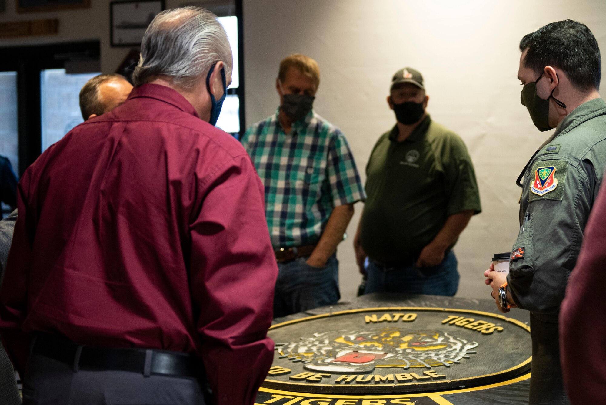 A U.S. Air Force Pilot from the 391st Fighter Squadron educates community leaders on the history of the squadron during a Treasure Valley Partnership tour on Mountain Home Air Force Base, Idaho, Sept. 9, 2021. The tour showcased the importance of our mission here to build strong relationships within the community.
