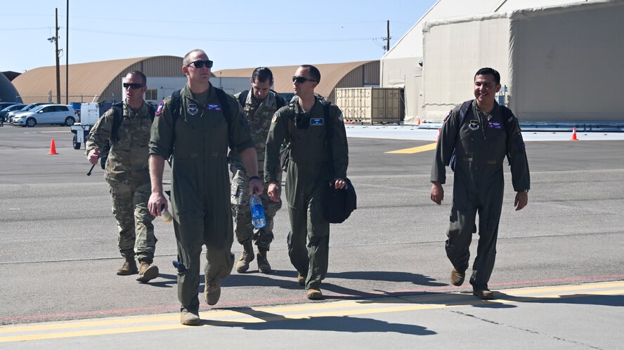 Leadership of exercise agile combat employment reaper from Holloman Air Force Base walk to a C-17 Globemaster III Sept. 8, 2021, Holloman AFB, New Mexico.