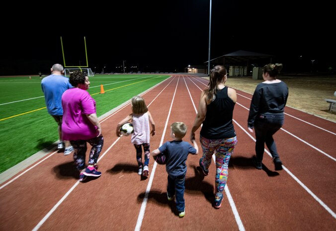 Beale’s walking group walks around the track.