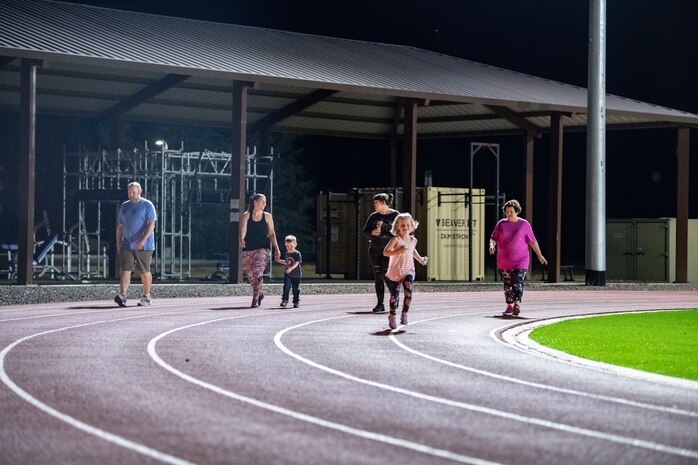 Beale’s walking group walks around the track.