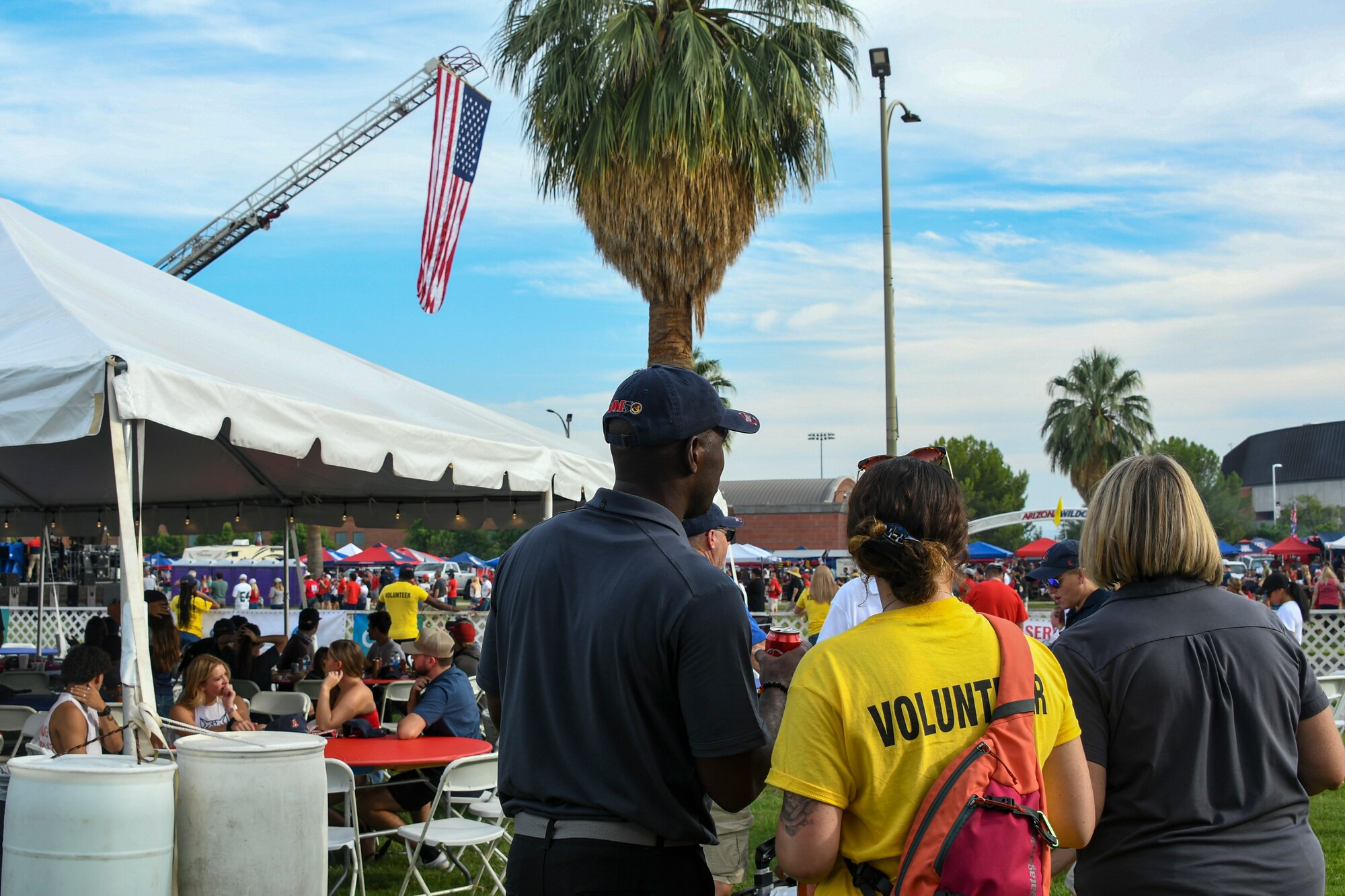 A photo of the DM 50 along with other military volunteers setting up a tailgate.