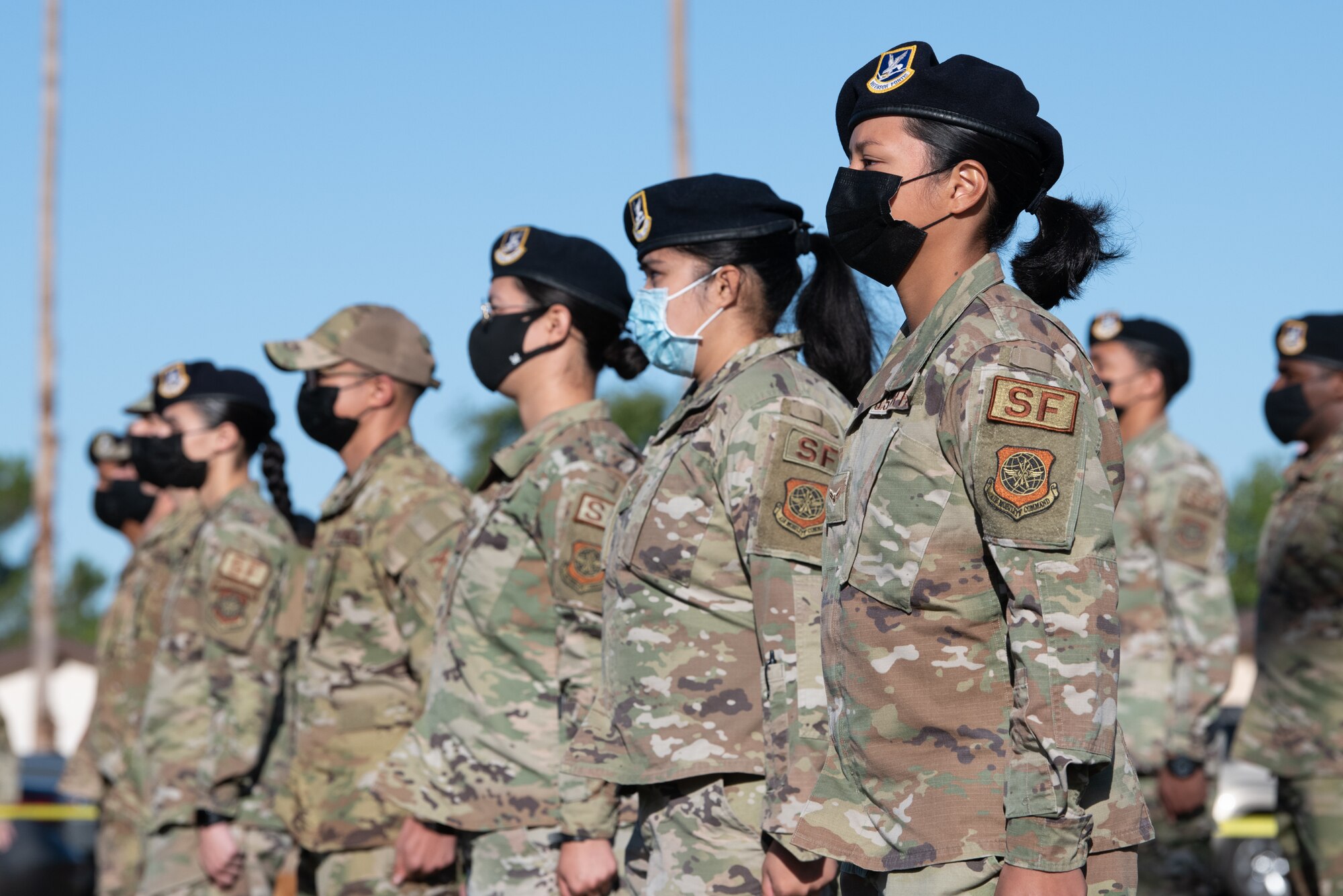 Airmen stand in attention