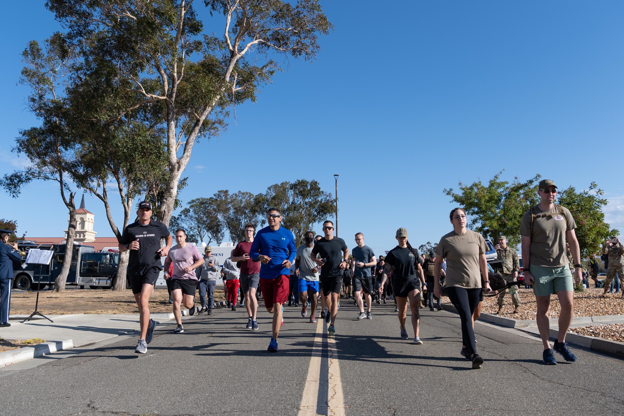 Airmen running with ruck sack