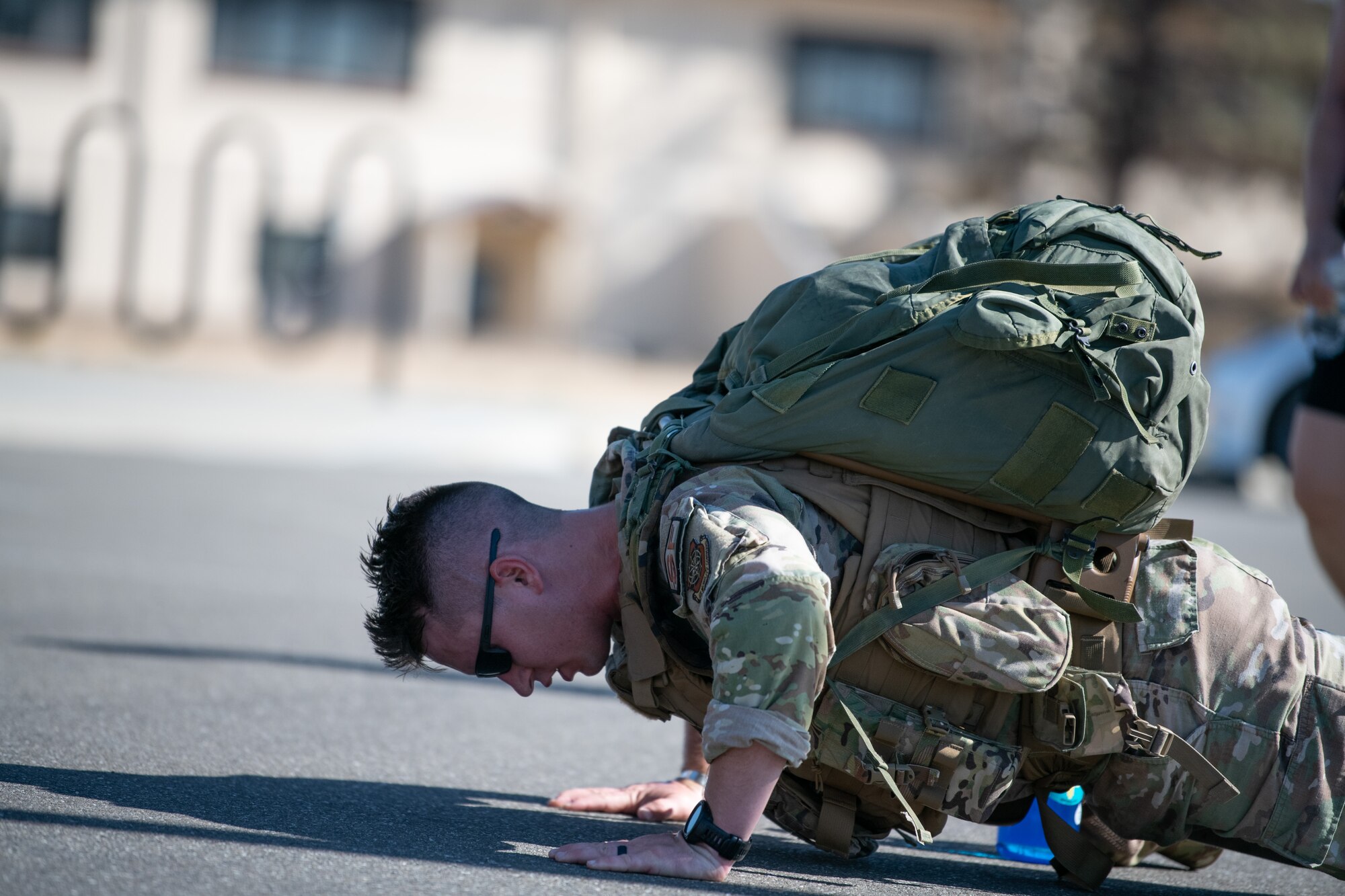 Airmen running with ruck sack