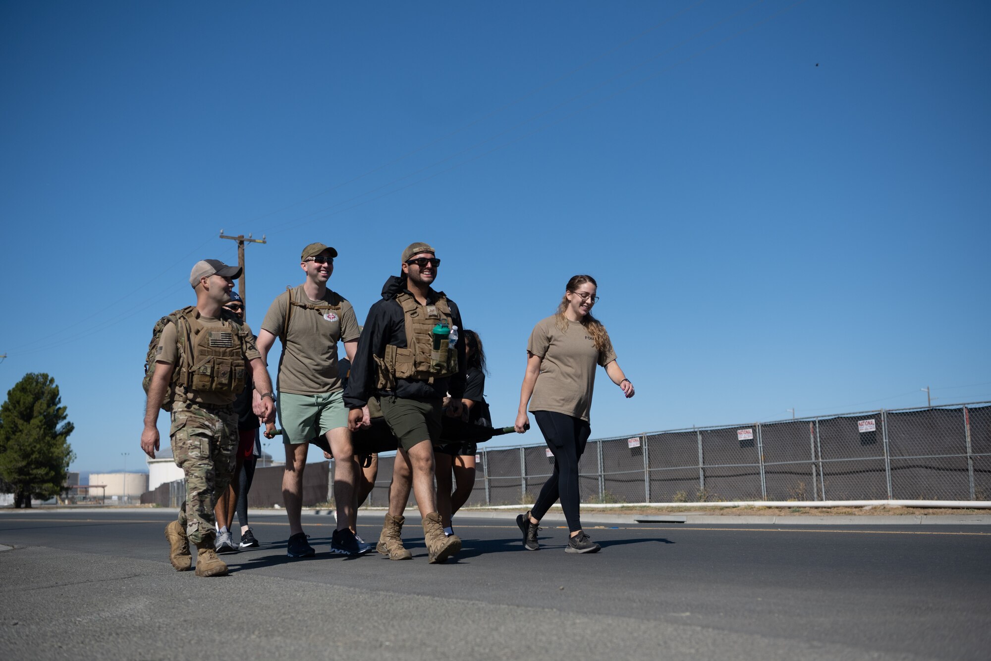 Airmen running with ruck sack