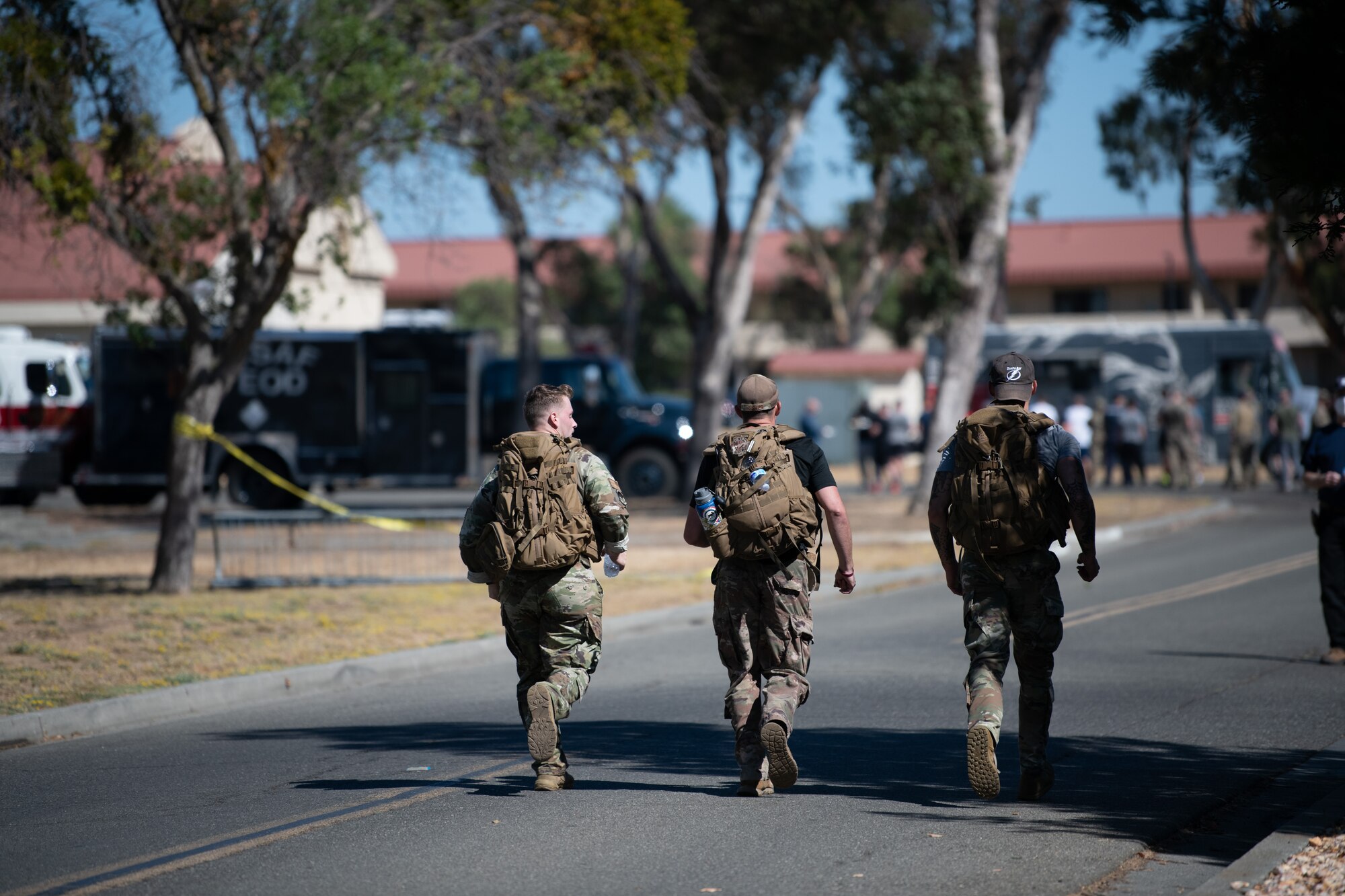 Airmen running with ruck sack