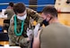 Tech. Sgt. Abigail Johannesson, 692d Intelligence Reconnaissance Surveillance Group noncommissioned officer-in-charge of medical operations, administers a Covid-19 vaccine to Senior Airman Andrew Parker, 647th Civil Engineer Squadron pest management apprentice, in the Hickam Gymnasium at Joint Base Pearl Harbor-Hickam, Hawaii, Sept. 8, 2021. The vaccination clinic supported a Department of Defense priority of vaccinating every eligible Service member to improve readiness and positively impact their families, neighbors, and communities in which they serve. (U.S. Air Force photo by Senior Airman Alan Ricker)