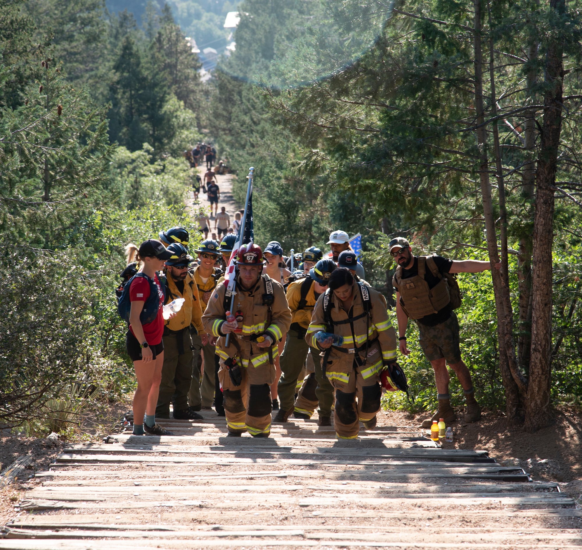 Firefighters climb the Manitou Incline