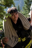 A local firefighter climbs the Manitou Incline.