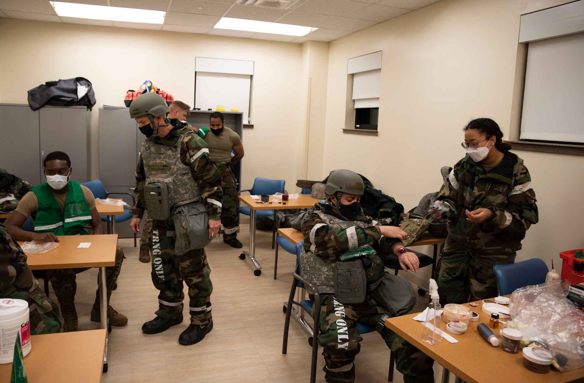 Members from the 51st Medical Group are prepped with moulage makeup prior to a training exercise