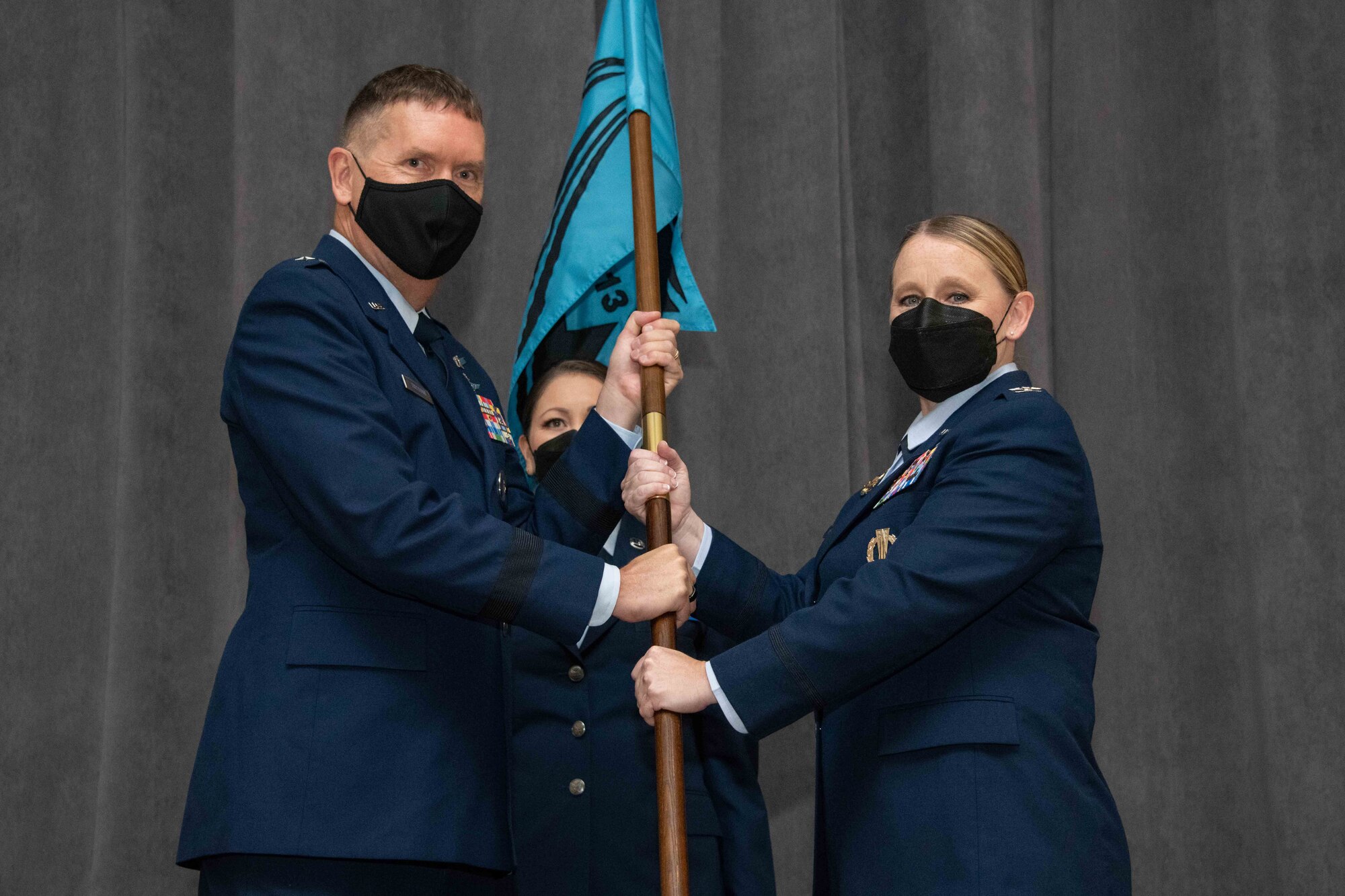 Brig. Gen. Shawn Bratton, Space Training and Readiness Command commander presents the guidon of U.S. Space Force Space Delta 13 to Col. Niki Lindhorst during the unit’s activation and assumption of command ceremony, Sep. 13, 2021.