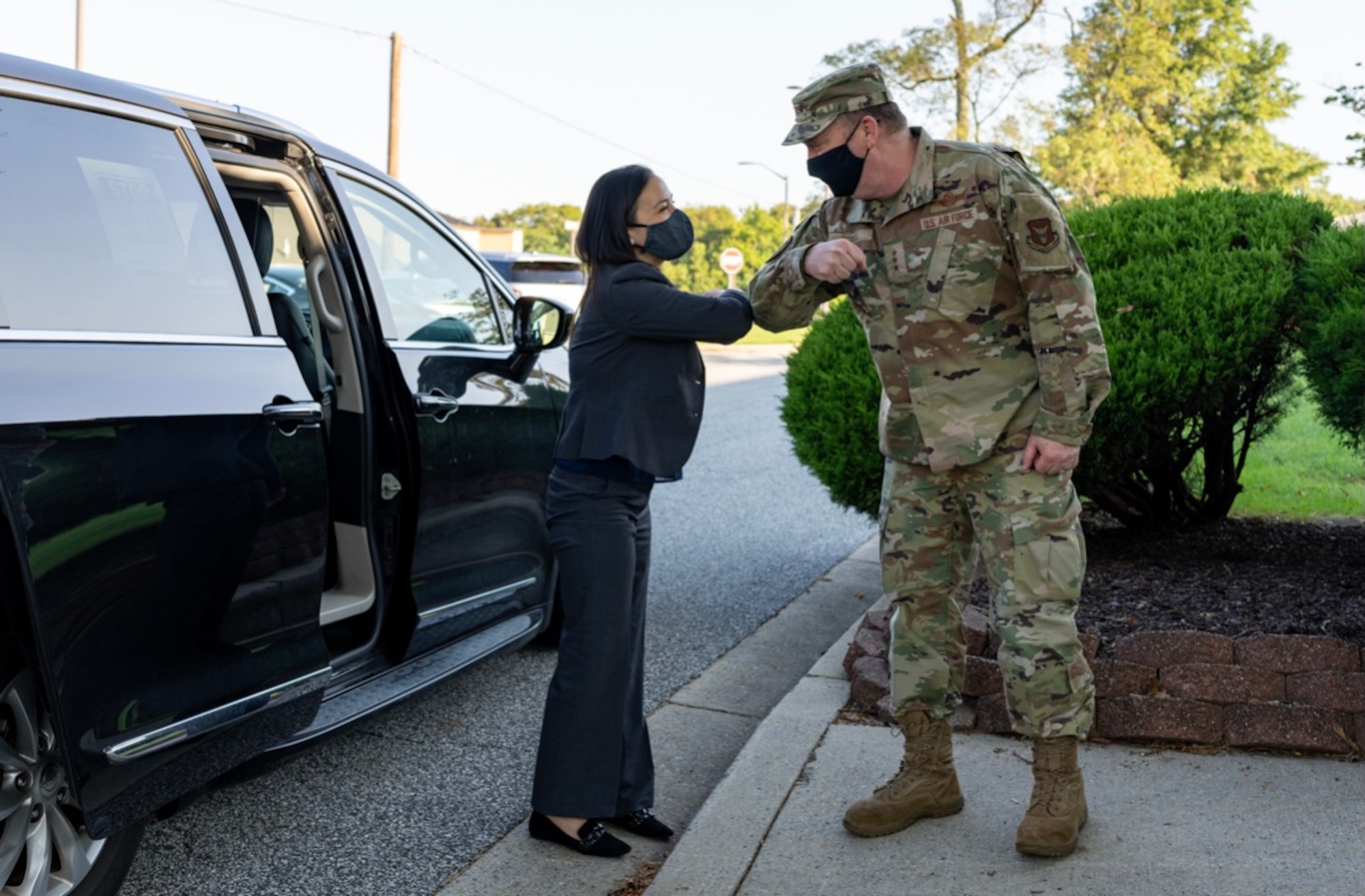 Under Secretary of the Air Force Gina Ortiz Jones greets Lt. Gen. Richard Scobee, Chief of the Air Force Reserve and Commander, Air Force Reserve Command, as she prepares for a meeting with 459th ARW Reservists, Sept. 11, 2021, at Joint Base Andrews, Md. The USecAF traveled to Joint Base Andrews to meet with wing leaders to discuss mandatory COVID vaccination efforts. (U.S. Air Force photo by Tech Sgt. Brent Skeen/Released)