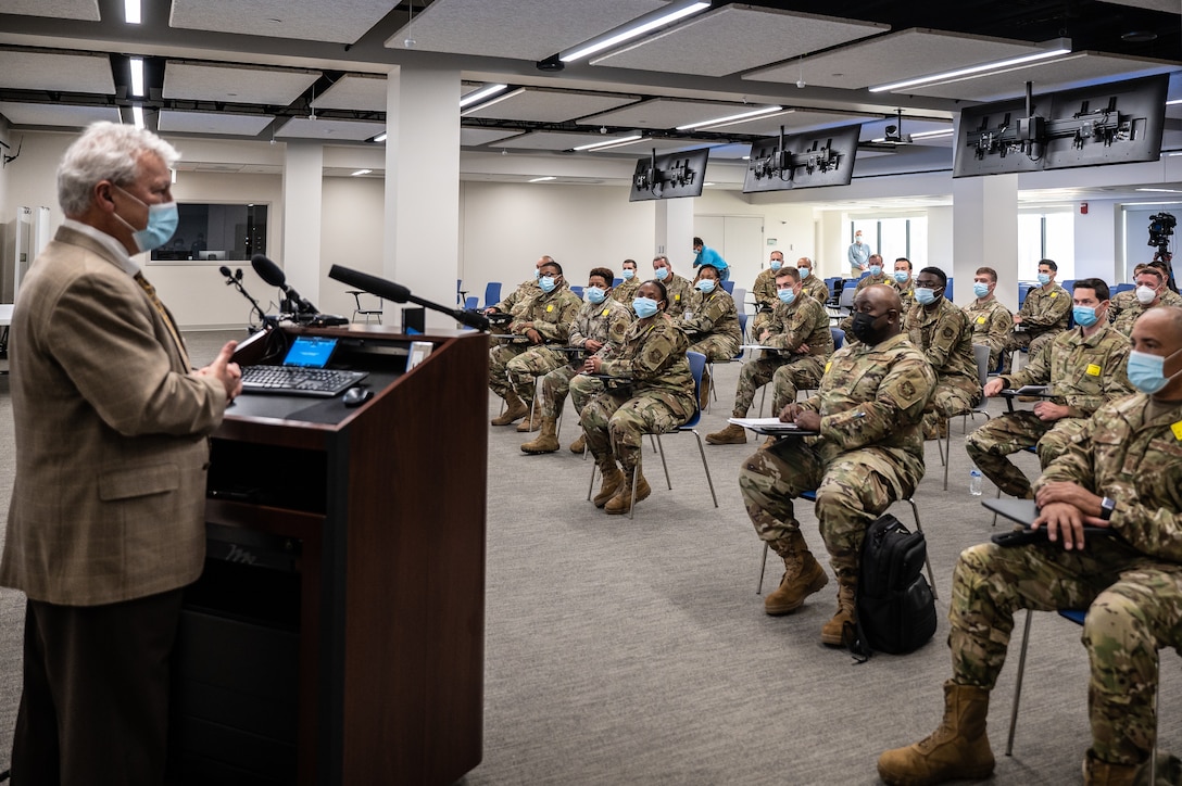 Larry Gray (left), president of Baptist Health Louisville, welcomes more than 40 Airmen from the Kentucky Air National Guard to Baptist Hospital East in Louisville, Ky., Sept.14, 2021. The Airmen will provide logistical support to medical staff struggling to keep pace with the rising number of critically ill COVID patients. They are part of 310 Kentucky Army and Air National Guard Soldiers and Airmen who were activated last week by Gov. Andy Beshear to provide non-clinical support to 21 hospitals across the Commonwealth. (U.S. Air National Guard photo by Dale Greer)