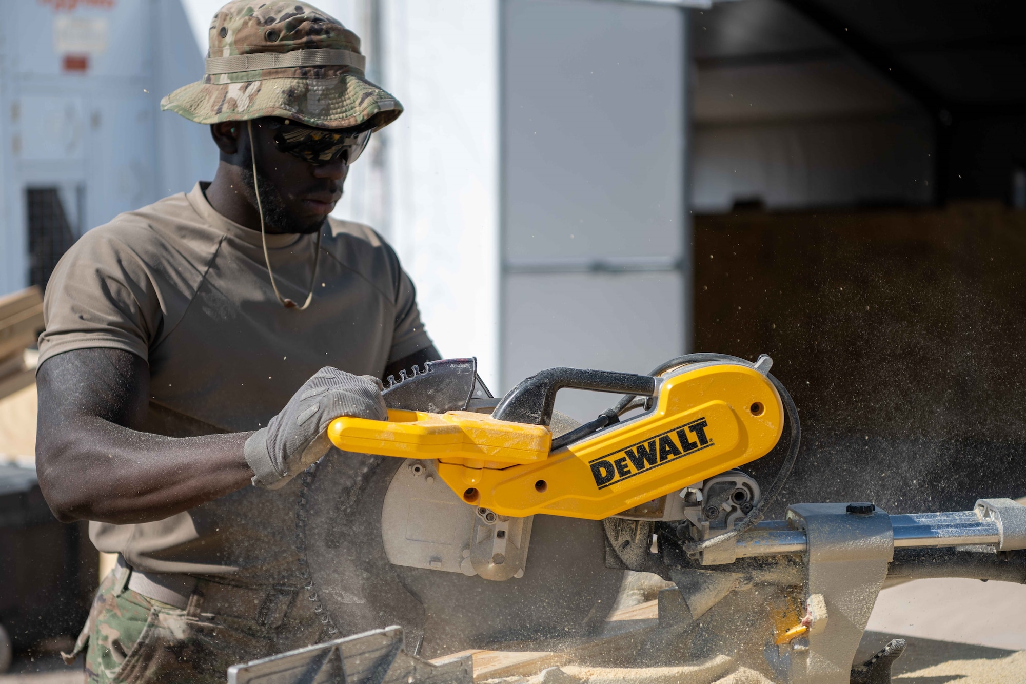 An Airman attached to Task Force-Holloman build housing for Afghan personnel in support of Operation Allies Welcome on Aman Omid Village at Holloman Air Force Base, New Mexico, Sept. 13, 2021. The Department of Defense, through U.S. Northern Command, and in support of the Department of State and Department of Homeland Security, is providing transportation, temporary housing, medical screening, and general support for at least 50,000 Afghan evacuees at suitable facilities, in permanent or temporary structures, as quickly as possible. This initiative provides Afghan evacuees essential support at secure locations outside Afghanistan. (U.S. Air Force photo by Senior Airman Skyler Combs)