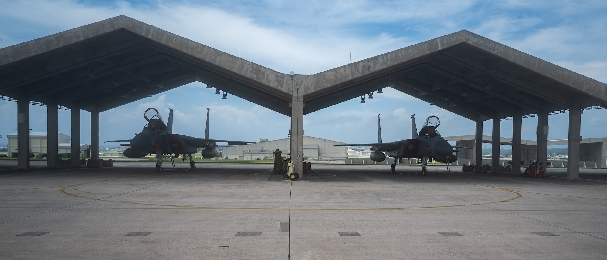 U.S. Air Force Airmen from the 67th Aircraft Maintenance Unit prepare for pre-flight inspections of an F-15C eagle at Kadena Air Base, Japan, Sept. 14, 2021. The 18th Wing is home to the 67th and 44th Fighter Squadrons. (U.S. Air Force photo by Airman 1st Class Stephen Pulter)