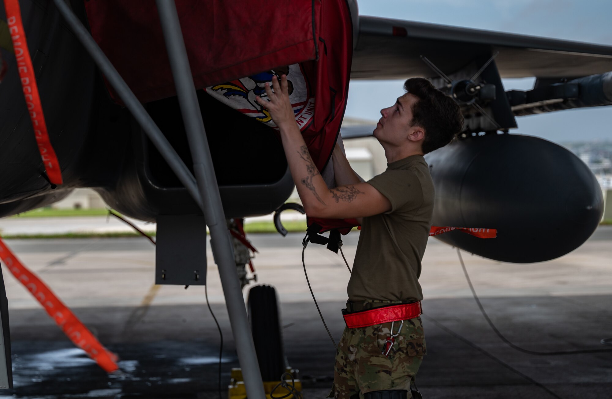U.S. Air Force Airman 1st Class Zach Huschley, 67th Aircraft Maintenance Unit aerospace propulsion engineer, removes an intake cover at Kadena Air Base, Japan, Sept. 14, 2021. The F-15C Eagle is an all-weather, extremely maneuverable, tactical fighter designed to permit the Air Force to gain and maintain air supremacy over the battlefield. (U.S. Air Force photo by Airman 1st Class Stephen Pulter)