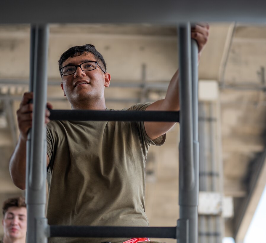 U.S. Air Force Airman 1st Class Joel Hernandez, 67th Aircraft Maintenance Unit crew chief, climbs up to the cockpit of an F-15C Eagle at Kadena Air Base, Japan, Sept. 14, 2021. The 18th Wing is home to a fleet of 54 F-15C’s, capable of delivering decisive airpower at a moment’s notice. (U.S. Air Force photo by Airman 1st Class Stephen Pulter)
