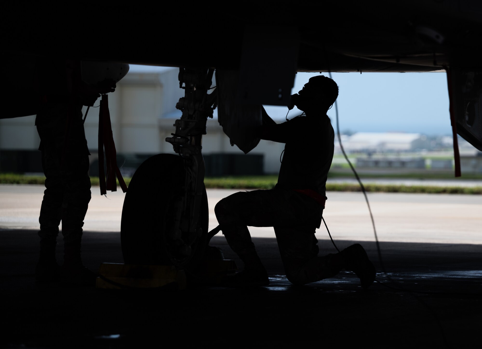 U.S. Air Force Airman 1st Class Joel Hernandez, 67th Aircraft Maintenance Unit crew chief, conducts preflight checks on an F-15C Eagle at Kadena Air Base, Japan, Sept. 14, 2021. Crew chiefs are responsible for the maintenance of their assigned aircraft, ensuring it’s ready to complete missions. (U.S. Air Force photo by Airman 1st Class Stephen Pulter)