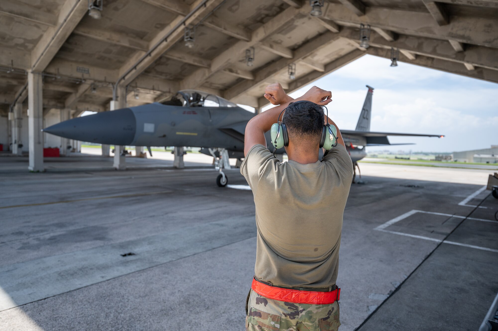 U.S. Air Force Airman 1st Class Joel Hernandez, 67th Aircraft Maintenance Unit crew chief, conducts preflight checks on an F-15C Eagle at Kadena Air Base, Japan, Sept. 14, 2021. Crew chiefs are responsible for day-to-day maintenance, including end-of-runway, postflight, preflight, thru-flight, special inspections and phase inspections. (U.S. Air Force photo by Airman 1st Class Stephen Pulter)