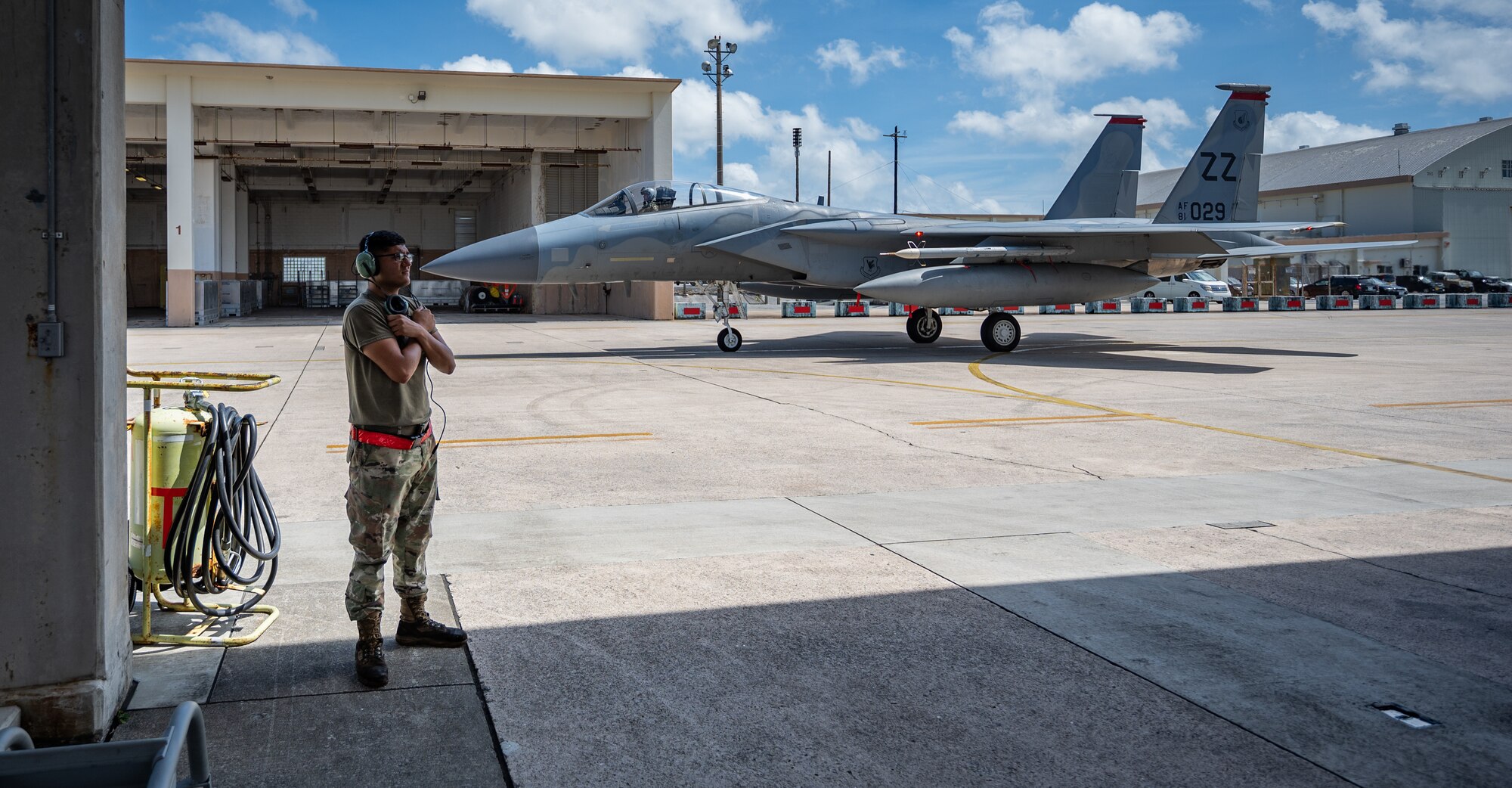 U.S. Air Force Airman 1st Class Joel Hernandez, 67th Aircraft Maintenance Unit crew chief, signals to the pilot of an F-15C Eagle at Kadena Air Base, Japan, Sept. 14, 2021. The life of a dedicated crew chief requires non-stop dedication, day and night, to maintain air-to-air combat superiority. (U.S. Air Force photo by Airman 1st Class Stephen Pulter)