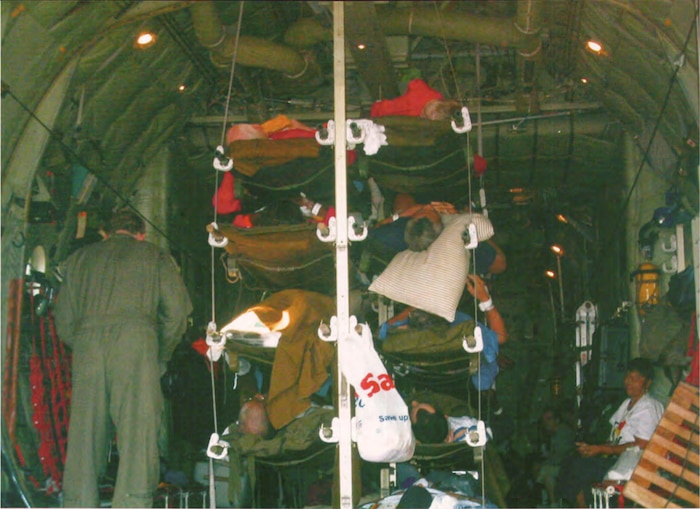Image of patients in the back of an aircraft.