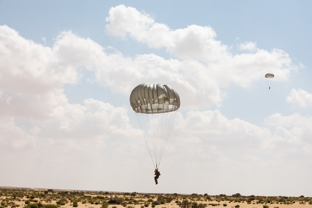 A U.S. Special Forces operator prepares to land in the drop zone during his free fall friendship jump with partner nations during Bright Star 21 (BS21) at Mohamed Naguib Military Base (MNMB), Egypt, Sept. 9, 2021. BS21 promotes faster responses to regional threats, while building a framework of countering terrorism. (U.S. Army photo by Spc. Amber Cobena)