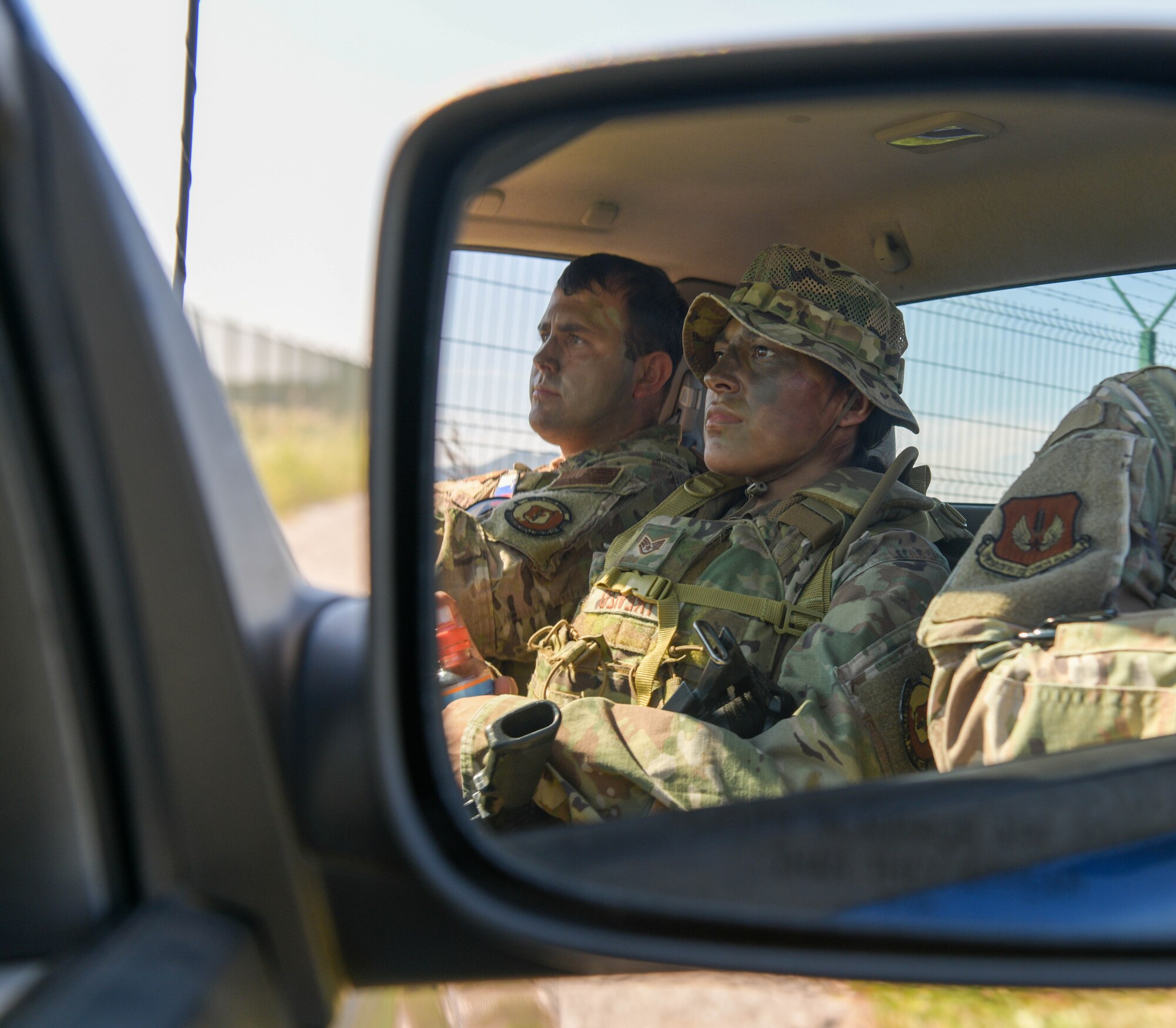 U.S. Air Force Staff Sgt. Levi Schofield, 31st Security Forces Squadron fire team leader, left, and U.S. Air Force Staff Sgt. Lesley Trevizo, 31st SFS vault storage area supervisor, patrol an airfield during exercise Agile Wyvern at Cerklje ob Krki Air Base, Slovenia, Sept. 8, 2021. Airmen assigned to the 31st SFS members performed 24-hour patrols with host nation partners, set up listening and observation posts, and searched key terrain during the exercise. (U.S. Air Force photo by Senior Airman Brooke Moeder)