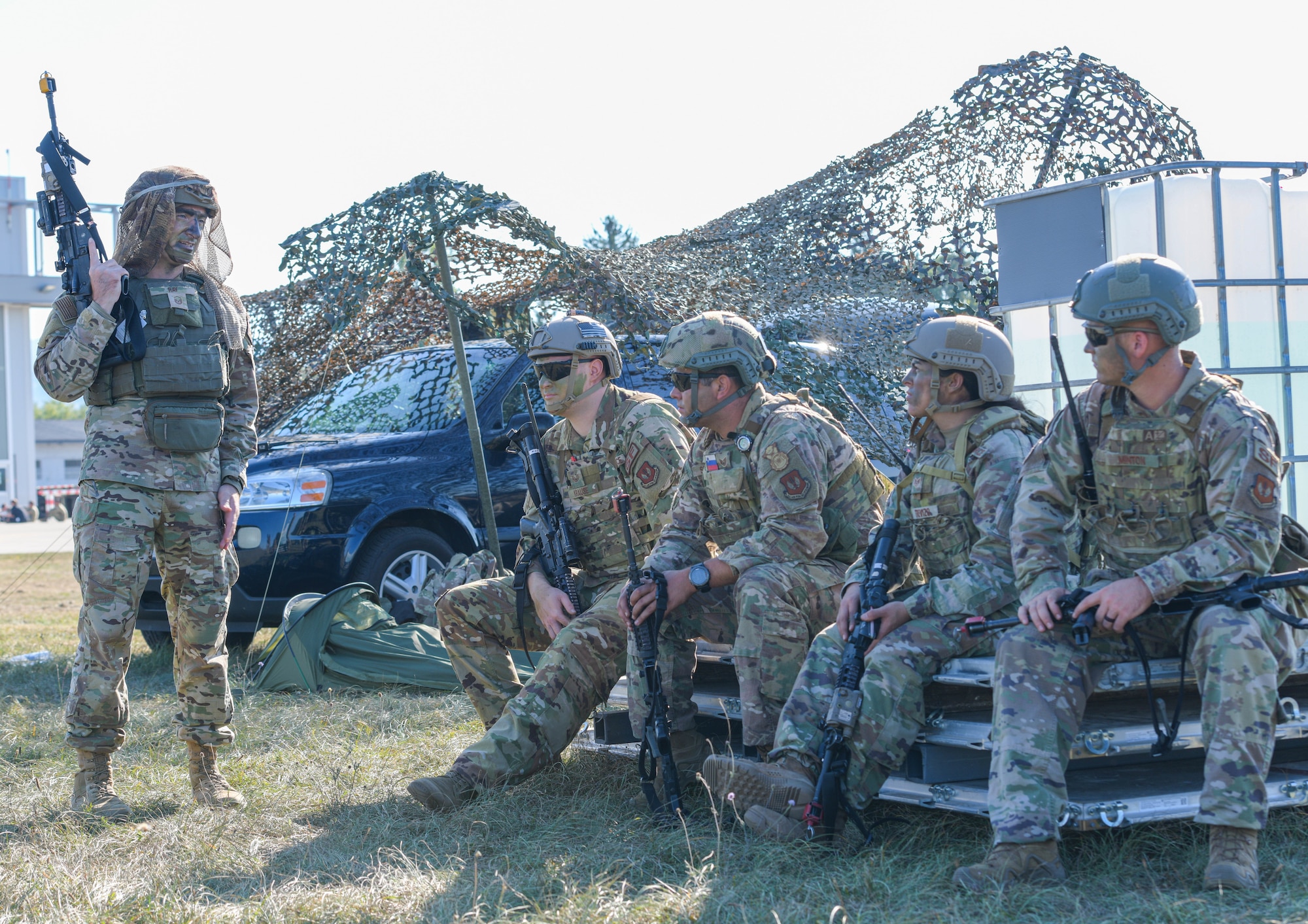 U.S. Air Force Master Sgt. Logan Ray, 31st Security Forces Squadron chief of standardization and evaluation, talks to his team before responding to a ground attack exercise at Cerklje ob Krki Air Base, Slovenia, Sept. 8, 2021. U.S. Soldiers assigned to the 173rd Airborne Brigade, United States Army Garrison, Italy, executed and simulated an airfield seizure while members from the 31st SFS practiced the measures needed to defend assets. (U.S. Air Force photo by Senior Airman Brooke Moeder)
