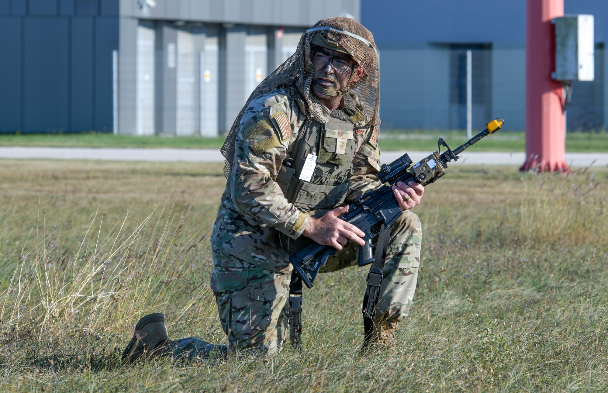 U.S. Air Force Master Sgt. Logan Ray, 31st Security Forces Squadron chief of standardization and evaluation, performs tactical maneuvers during a contingency response to a ground attack exercise at Cerklje ob Krki Air Base, Slovenia, Sept. 8, 2021. U.S. Soldiers assigned to the 173rd Airborne Brigade, 173rd Airborne Brigade, United States Army Garrison, Italy, executed and simulated an airfield seizure while members from the 31st SFS practiced the measures needed to defend assets. (U.S. Air Force photo by Senior Airman Brooke Moeder)
