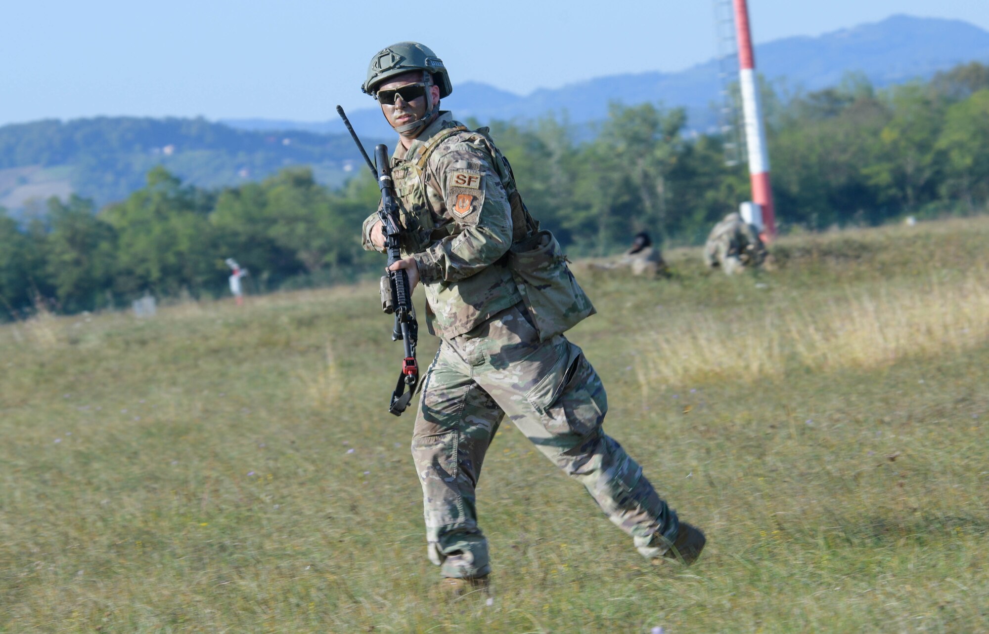 U.S. Air Force Staff Sgt. Dustin Minton, 31st Security Forces Squadron area supervisor, participates in contingency response to a ground attack exercise during Agile Wyvern at Cerklje ob Krki Air Base, Slovenia, Sept. 8, 2021. U.S. Air Force F-16 Fighting Falcons and Airmen assigned to the 31st Fighter Wing participated in exercise Agile Wyvern during which U.S. and Slovenian Armed Forces conducted Agile Combat Employment training. (U.S. Air Force photo by Senior Airman Brooke Moeder)