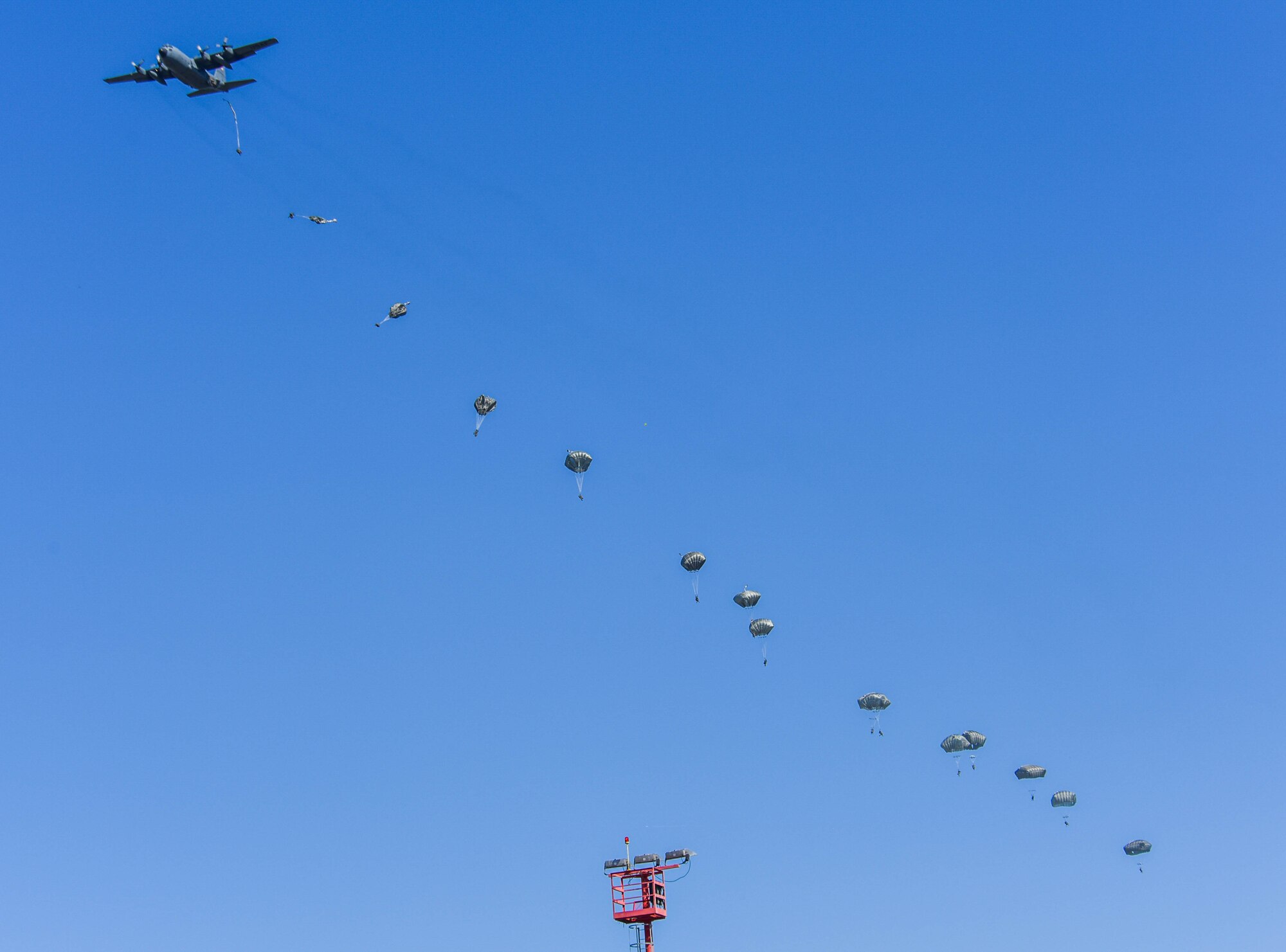 U.S. Paratroopers from the 173rd Airborne Brigade jump out of a U.S. Air Force C-130 Hercules during exercise Agile Wyvern at Cerklje ob Krki Air Base, Slovenia, Sept. 8, 2021. Sky Soldiers of 2nd Battalion, 503rd Parachute Infantry Regiment “The Rock,” merged with the 31st Fighter Wing’s Agile Wyvern operations as part of their own separate exercise to show small unit proficiency, tactical competence and to solidify partnerships with the Slovenian 74th Infantry Regiment. (U.S. Air Force photo by Senior Airman Brooke Moeder)