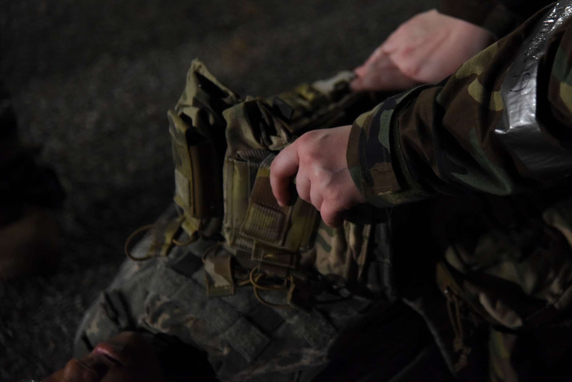 A 51st Security Forces Squadron Defender searches an assailant in a scenario during a routine training event