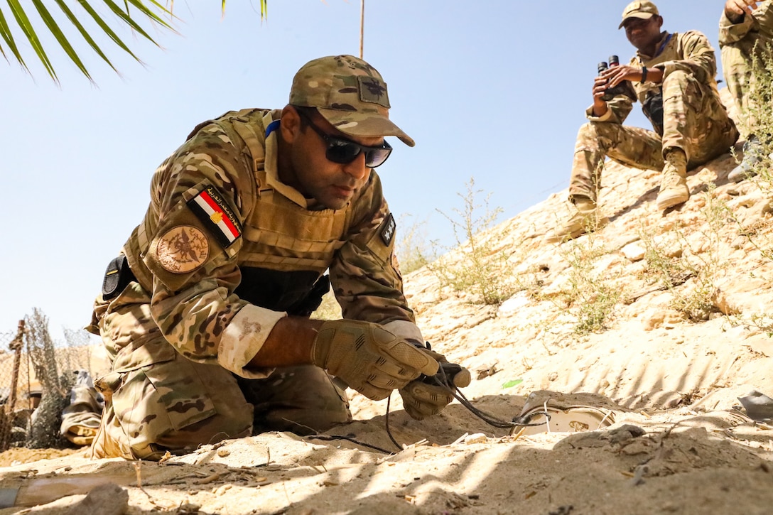 MOHAMED NAGUIB MILITARY BASE, Egypt (Sept. 12 2021) – U.S. Navy explosive ordinance disposal technicians assigned to Task Force 56 and Egyptian Naval Force personnel conduct counter improvised explosive device training at Mohamed Naguib Military Base, Egypt, Sept 11. Bright Star (BS) 21 is a multi-lateral exercise hosted by the Arab Republic of Egypt along with support from U.S. Central Command (USCENTCOM). BS21 provides an opportunity for USCENTCOM to pursue better ways to address specific threats to regional security at the tactical, operational, and strategic levels. (U.S. Army Photo by Spc. Aleksander Fomin)